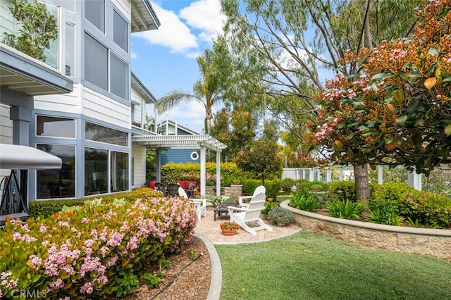 25382 Village Rd, Dana Point, CA 92629 - view of yard with a pergola, an outdoor fire pit, and a patio area