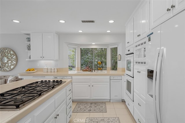 25382 Village Rd, Dana Point, CA 92629 - kitchen with white appliances, a sink, light countertops, white cabinets, and recessed lighting