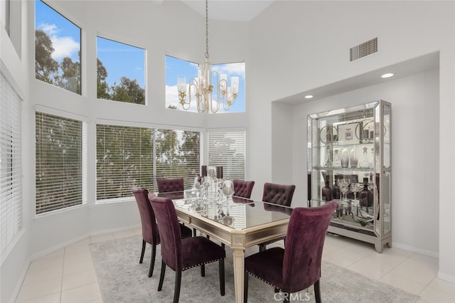 25382 Village Rd, Dana Point, CA 92629 - dining room featuring a towering ceiling, light tile patterned flooring, a chandelier, baseboards, and recessed lighting