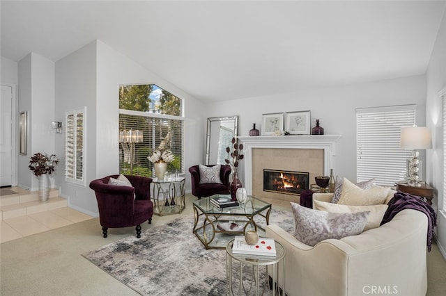 25382 Village Rd, Dana Point, CA 92629 - living room featuring a fireplace, carpet, vaulted ceiling, and baseboards