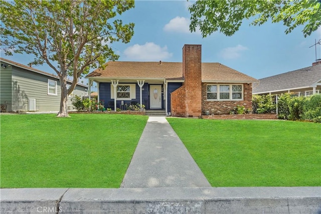 11330 Whitley St, Whittier, CA 90601 - ranch-style house with a chimney, a front lawn, and brick siding