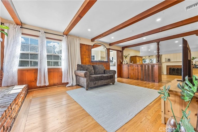 11330 Whitley St, Whittier, CA 90601 - living room with beamed ceiling, light wood finished floors, a fireplace, recessed lighting, and arched walkways