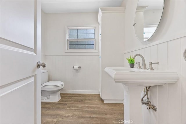11330 Whitley St, Whittier, CA 90601 - bathroom with wood finished floors, wainscoting, and a decorative wall