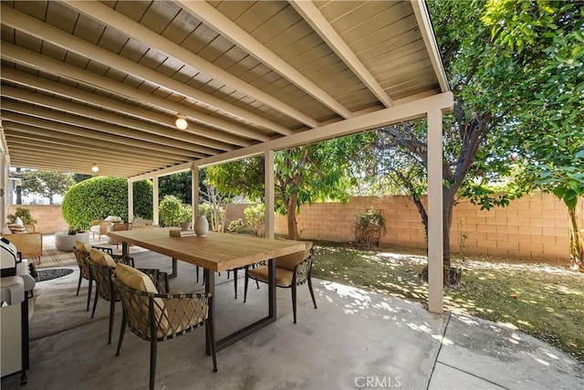 view of patio with a fenced backyard and outdoor dining space