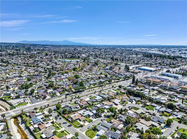 drone / aerial view featuring a residential view and a mountain view