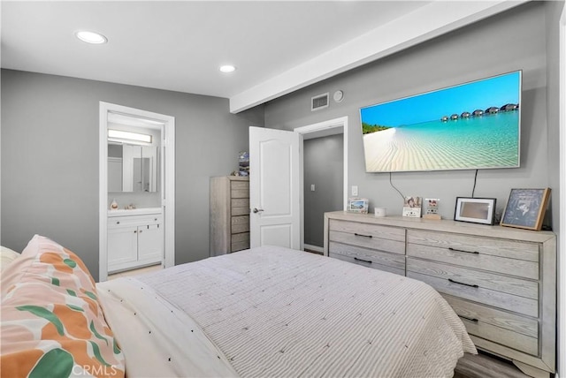 bedroom featuring recessed lighting, connected bathroom, and visible vents