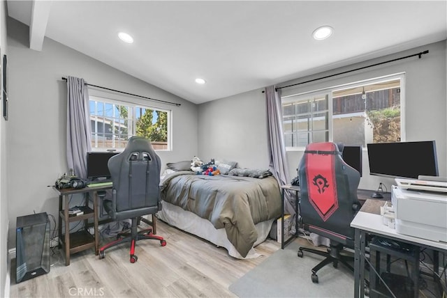 bedroom with lofted ceiling, wood finished floors, and recessed lighting