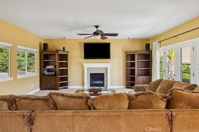 1100 N Ferrocarril Rd, Atascadero, CA 93422 - living area featuring a ceiling fan, baseboards, a fireplace, and plenty of natural light