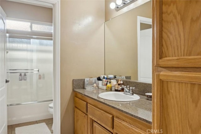 1100 N Ferrocarril Rd, Atascadero, CA 93422 - bathroom featuring toilet, vanity, combined bath / shower with glass door, and tile patterned floors