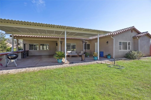 1100 N Ferrocarril Rd, Atascadero, CA 93422 - back of house with a yard, an outdoor hangout area, stucco siding, and a patio