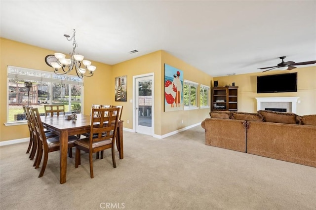 1100 N Ferrocarril Rd, Atascadero, CA 93422 - dining room featuring a chandelier, baseboards, light carpet, and a fireplace