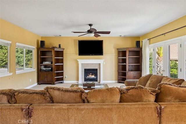 1100 N Ferrocarril Rd, Atascadero, CA 93422 - living area featuring ceiling fan, baseboards, a fireplace with flush hearth, and plenty of natural light