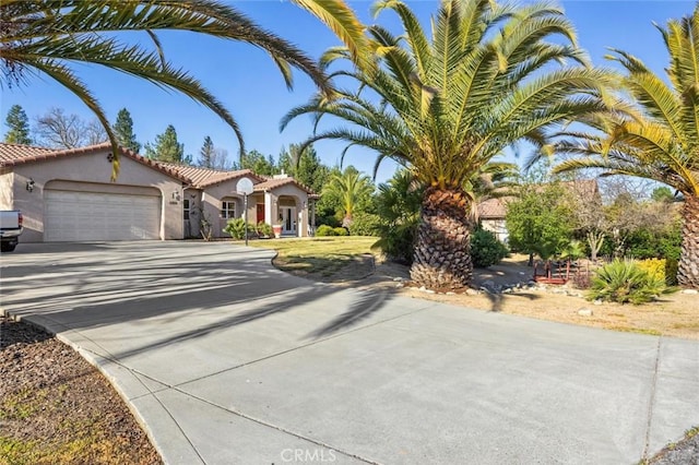 1100 N Ferrocarril Rd, Atascadero, CA 93422 - mediterranean / spanish-style home with driveway, a garage, and stucco siding