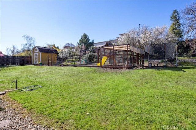 1100 N Ferrocarril Rd, Atascadero, CA 93422 - view of yard featuring a playground, a storage unit, an outdoor structure, and a trampoline