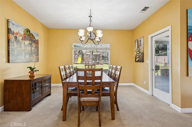 1100 N Ferrocarril Rd, Atascadero, CA 93422 - dining room with a chandelier, light colored carpet, and baseboards