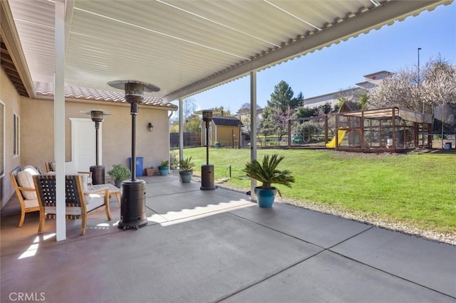1100 N Ferrocarril Rd, Atascadero, CA 93422 - view of patio with a playground, a storage shed, and an outbuilding