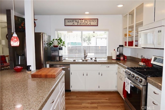 31351 Calle Del Campo, San Juan Capistrano, CA 92675 - kitchen with stainless steel appliances, a sink, white cabinets, recessed lighting, and light wood-type flooring