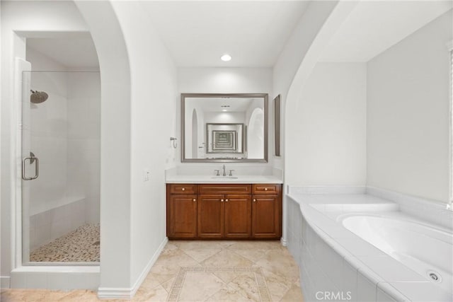 68 Sanctuary, Irvine, CA 92620 - bathroom with a bath, a shower stall, vanity, inlaid floor details, and recessed lighting