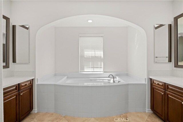 68 Sanctuary, Irvine, CA 92620 - bathroom featuring vanity, a garden tub, and tile patterned flooring
