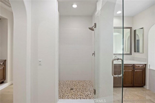 68 Sanctuary, Irvine, CA 92620 - bathroom with a shower stall, vanity, recessed lighting, and tile patterned floors