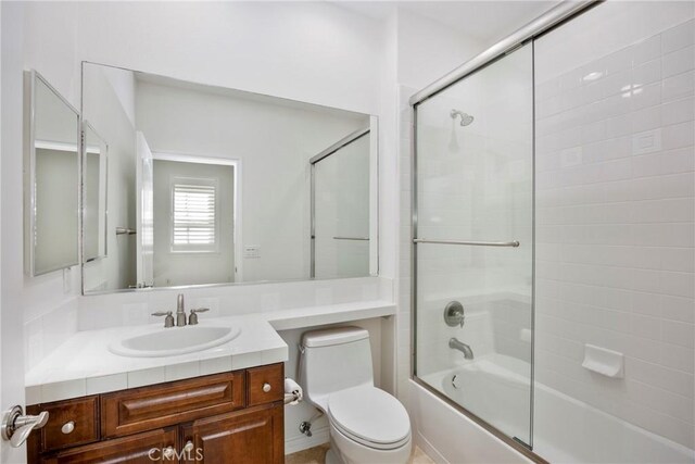 68 Sanctuary, Irvine, CA 92620 - bathroom with vanity, enclosed tub / shower combo, and toilet