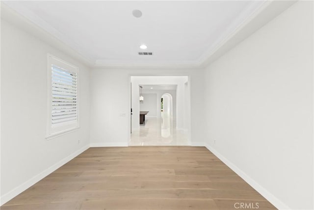 68 Sanctuary, Irvine, CA 92620 - unfurnished room with crown molding, arched walkways, light wood-type flooring, baseboards, and recessed lighting