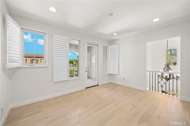 68 Sanctuary, Irvine, CA 92620 - spare room with baseboards, wood finished floors, and recessed lighting