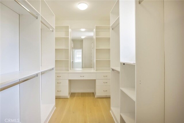 68 Sanctuary, Irvine, CA 92620 - walk in closet featuring light wood finished floors