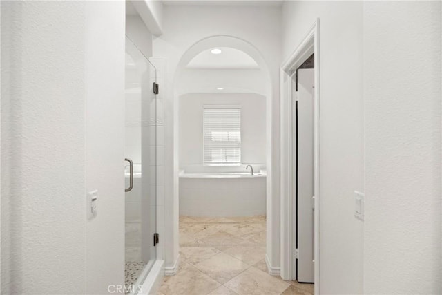 68 Sanctuary, Irvine, CA 92620 - hall featuring arched walkways and light tile patterned floors