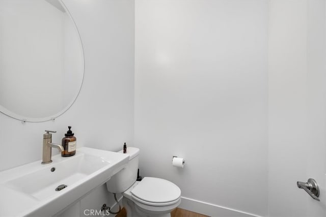 160 Earthwood Ln, San Luis Obispo, CA 93401 - half bath featuring baseboards, a sink, and toilet