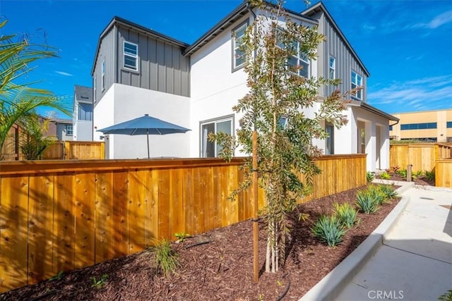 160 Earthwood Ln, San Luis Obispo, CA 93401 - view of side of property with board and batten siding and fence