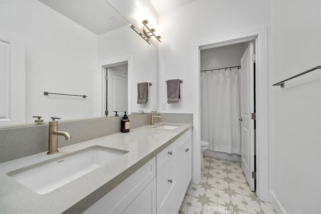 160 Earthwood Ln, San Luis Obispo, CA 93401 - bathroom with double vanity, a sink, tile patterned floors, and toilet