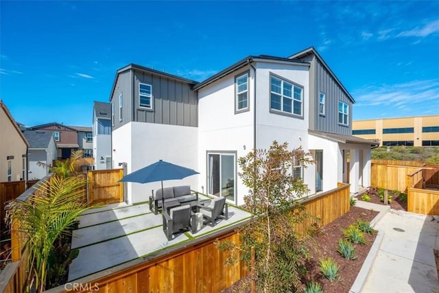 160 Earthwood Ln, San Luis Obispo, CA 93401 - back of property with a fenced backyard, board and batten siding, stucco siding, and a patio