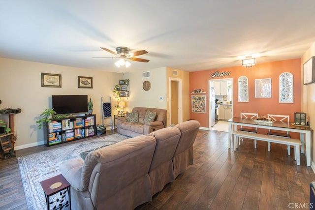 5270 E Anaheim Rd Unit 2, Long Beach, CA 90815 - living area with a ceiling fan, dark wood-style flooring, and baseboards