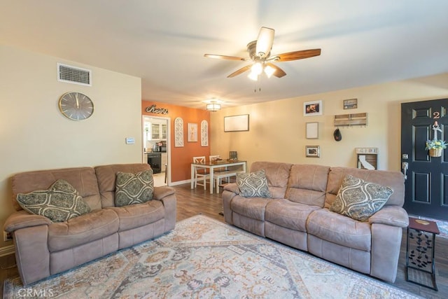 5270 E Anaheim Rd Unit 2, Long Beach, CA 90815 - living room featuring ceiling fan, wood finished floors, and baseboards