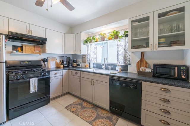 5270 E Anaheim Rd Unit 2, Long Beach, CA 90815 - kitchen with black appliances, under cabinet range hood, a sink, light tile patterned floors, and a ceiling fan