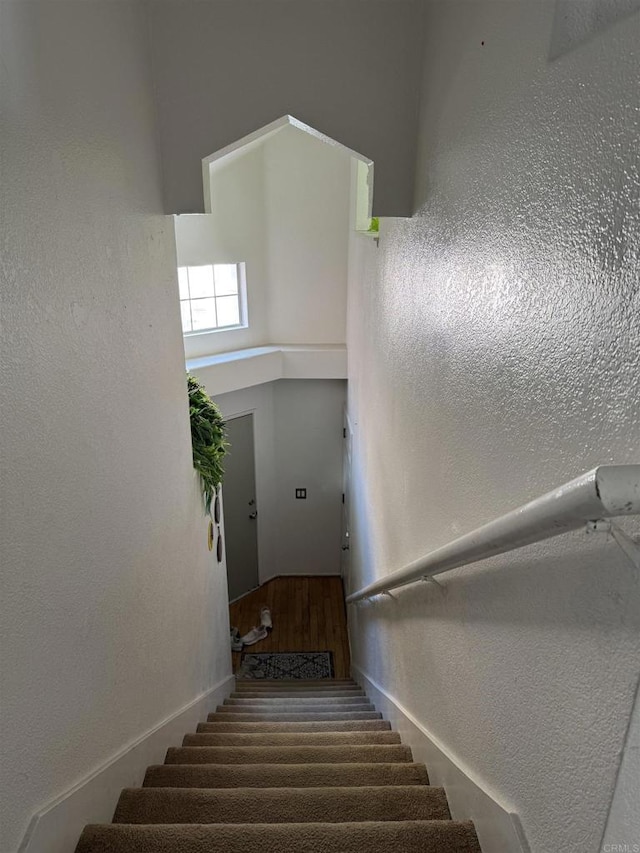 12090 Calle De Montana Unit 251, El Cajon, CA 92019 - staircase with a high ceiling
