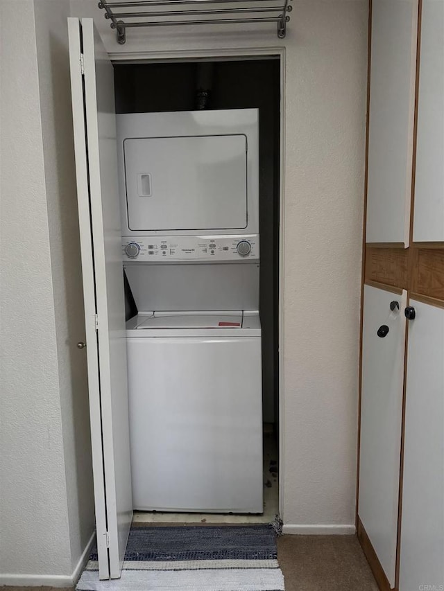12090 Calle De Montana Unit 251, El Cajon, CA 92019 - laundry area featuring baseboards, stacked washer / drying machine, and laundry area