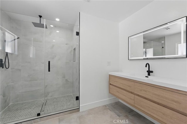 full bath with tile patterned flooring, vanity, recessed lighting, baseboards, and a shower stall