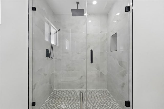 bathroom featuring a shower stall