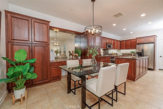 dining room featuring visible vents, light tile patterned floors, baseboards, a notable chandelier, and recessed lighting