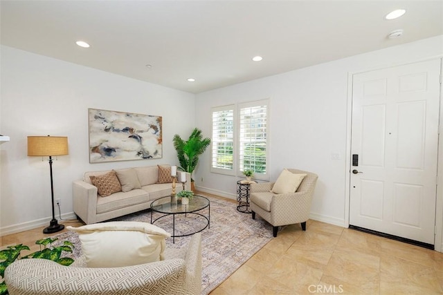 living room with recessed lighting and baseboards