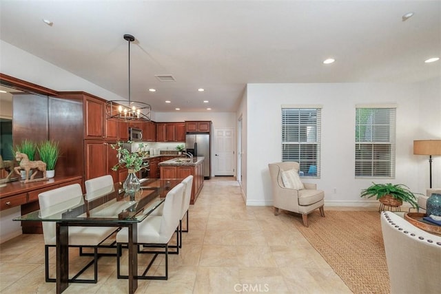 dining room featuring recessed lighting, baseboards, a notable chandelier, and visible vents