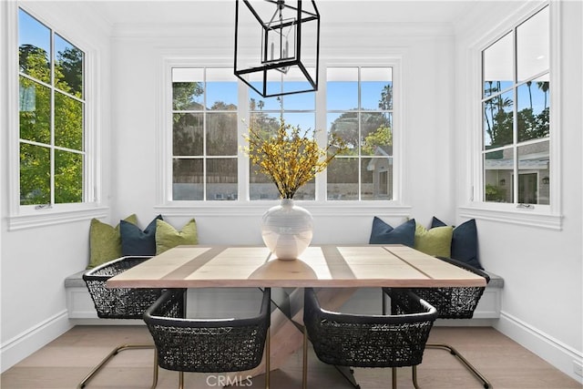sunroom / solarium featuring a healthy amount of sunlight