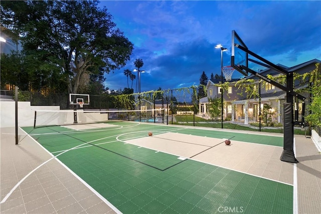 view of basketball court with community basketball court and fence
