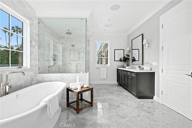 bathroom featuring crown molding, marble finish floor, vanity, a stall shower, and a freestanding bath