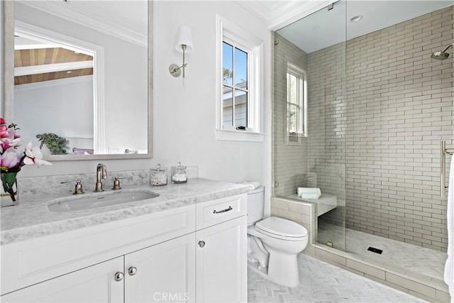 bathroom with a stall shower, toilet, vanity, and ornamental molding
