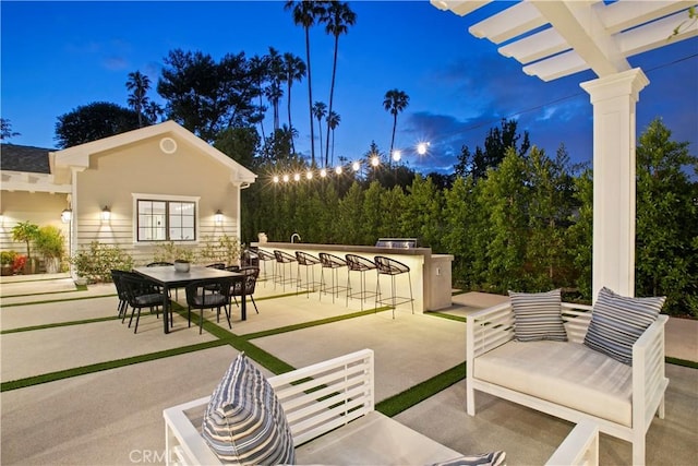 view of patio / terrace with outdoor dry bar and outdoor dining area