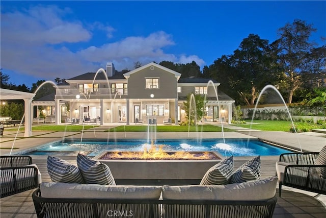 view of swimming pool with a yard and a patio