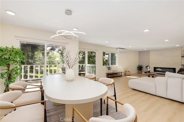 2405 Via Mariposa W Unit 1B, Laguna Woods, CA 92637 - dining area with an AC wall unit, wood finished floors, and recessed lighting